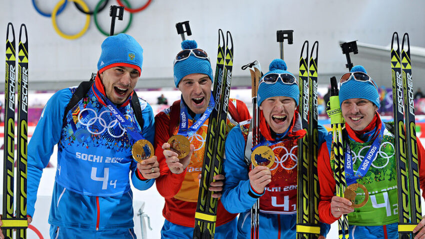 From left: Anton Shipulin (Russia), Dmitry Malyshko (Russia), Alexei Volkov (Russia), Evgeny Ustyugov (Russia), winners of the gold medals in the men's biathlon relay at the XXII Olympic Winter Games in Sochi, during the medal ceremony